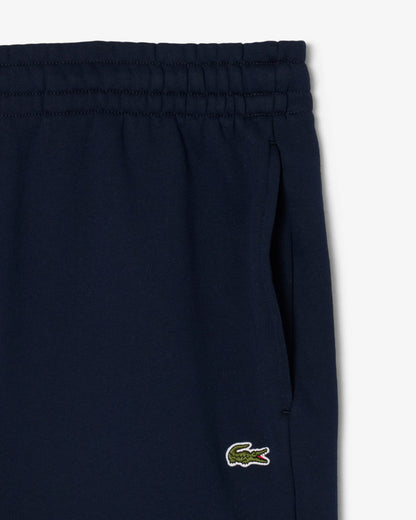 Lacoste - Pantaloni della tuta relaxed fit in tessuto felpato blu navy
